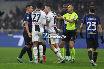 2023-12-09 - Lautaro Martinez of FC Internazionale protests with Nehuen Perez of Udinese Calcio during Serie A 2023/24 football match between FC Internazionale and Udinese Calcio at Giuseppe Meazza Stadium, Milan, Italy on December 09, 2023 - INTER - FC INTERNAZIONALE VS UDINESE CALCIO - ITALIAN SERIE A - SOCCER