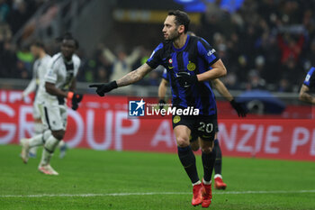 2023-12-09 - Hakan Calhanoglu of FC Internazionale celebrates after scoring a goal during Serie A 2023/24 football match between FC Internazionale and Udinese Calcio at Giuseppe Meazza Stadium, Milan, Italy on December 09, 2023 - INTER - FC INTERNAZIONALE VS UDINESE CALCIO - ITALIAN SERIE A - SOCCER