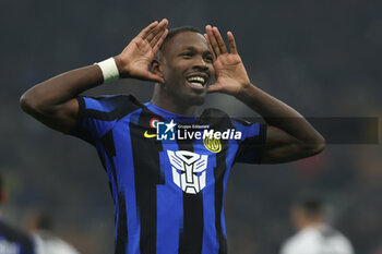 2023-12-09 - Marcus Thuram of FC Internazionale celebrates after scoring a goal during Serie A 2023/24 football match between FC Internazionale and Udinese Calcio at Giuseppe Meazza Stadium, Milan, Italy on December 09, 2023 - INTER - FC INTERNAZIONALE VS UDINESE CALCIO - ITALIAN SERIE A - SOCCER