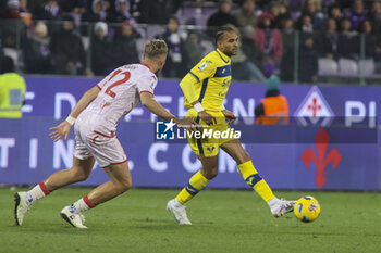 2023-12-17 - Jordi Mboula of Hellas Verona FC competes for the ball with Antonin Barak of ACF Fiorentina during ACF Fiorentina vs Hellas Verona FC, 16° Serie A Tim 2023-24 game at Artemio Franchi Stadium in Firenze (FI), Italy, on Dicember 17, 2023. - ACF FIORENTINA VS HELLAS VERONA FC - ITALIAN SERIE A - SOCCER