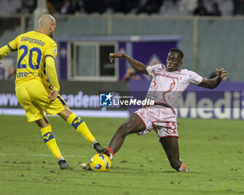 2023-12-17 - Riccardo Saponara of Hellas Verona FC battle for the ball with Michael Kayode of ACF Fiorentina during ACF Fiorentina vs Hellas Verona FC, 16° Serie A Tim 2023-24 game at Artemio Franchi Stadium in Firenze (FI), Italy, on Dicember 17, 2023. - ACF FIORENTINA VS HELLAS VERONA FC - ITALIAN SERIE A - SOCCER