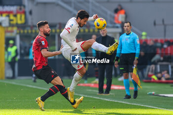 2023-12-17 - Andrea Carboni of AC Monza competes for the ball with Olivier Giroud of AC Milan during Serie A 2023/24 football match between AC Milan and AC Monza at San Siro Stadium, Milan, Italy on December 17, 2023 - AC MILAN VS AC MONZA - ITALIAN SERIE A - SOCCER