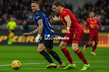 2023-12-23 - Marko Arnautovic of FC Internazionale competes for the ball with Federico Baschirotto of US Lecce during Serie A 2023/24 football match between FC Internazionale and US Lecce at Giuseppe Meazza Stadium, Milan, Italy on December 23, 2023 - INTER - FC INTERNAZIONALE VS US LECCE - ITALIAN SERIE A - SOCCER