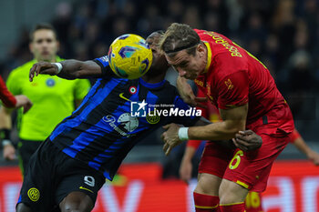 2023-12-23 - Federico Baschirotto of US Lecce competes for the ball with Marcus Thuram of FC Internazionale during Serie A 2023/24 football match between FC Internazionale and US Lecce at Giuseppe Meazza Stadium, Milan, Italy on December 23, 2023 - INTER - FC INTERNAZIONALE VS US LECCE - ITALIAN SERIE A - SOCCER