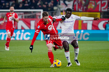 2023-12-22 - Georgios Kyriakopoulos (AC Monza) and Alfred Duncan (ACF Fiorentina) - AC MONZA VS ACF FIORENTINA - ITALIAN SERIE A - SOCCER