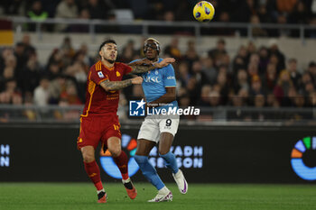2023-12-23 - Roma’s Argentinian midfielder Leandro Paredes challenges for the ball with SSC Napoli's Nigerian forward Victor Osimhen during the Serie A football match between AS Roma vs SSC Napoli Football Club at the Olimpico Stadium in Rome, Italy on December 23, 2023 - AS ROMA VS SSC NAPOLI - ITALIAN SERIE A - SOCCER