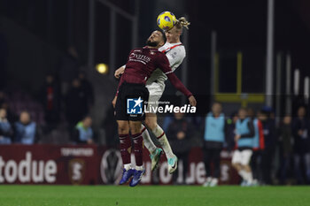2023-12-22 - Salernitana's Cypriot midfielder Grigoris Kastanos challenges for the ball with Milan’s Danish defender Simon Kjaer during the Serie A football match between Unione Sportiva Salernitana vs AC Milan at the Arechi Stadium in Salerno on December 22, 2023. - US SALERNITANA VS AC MILAN - ITALIAN SERIE A - SOCCER