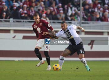 2023-12-23 - Walace of Udinese Calcio and Ivan Ilic of Torino Fc during the Italian Serie A, football match between Torino Fc and Udinese Calcio on 23 December 2023, at Studio Olimpic Grande Torino, Turin, Italy. Photo Nderim Kaceli - TORINO FC VS UDINESE CALCIO - ITALIAN SERIE A - SOCCER