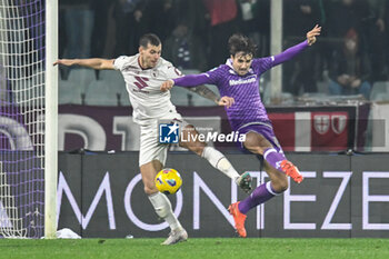 2023-12-29 - Torino's Pietro Pellegri fights for the ball against Fiorentina's Luca Ranieri - ACF FIORENTINA VS TORINO FC - ITALIAN SERIE A - SOCCER