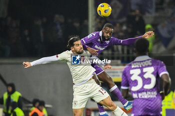 2023-12-29 - header of Fiorentina's Jonathan Ikone against Torino's Ricardo Rodriguez - ACF FIORENTINA VS TORINO FC - ITALIAN SERIE A - SOCCER
