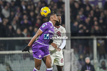 2023-12-29 - header of Fiorentina's Christian Kouame against Torino's Adrien Tameze - ACF FIORENTINA VS TORINO FC - ITALIAN SERIE A - SOCCER