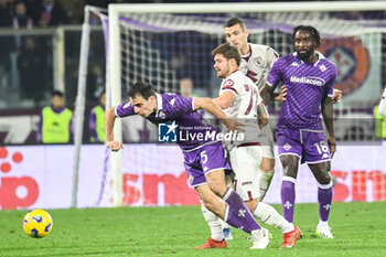 2023-12-29 - Fiorentina's Giacomo Bonaventura hampered by Torino's Karol Linetty - ACF FIORENTINA VS TORINO FC - ITALIAN SERIE A - SOCCER