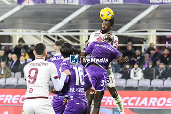 2023-12-29 - header of Torino's Adrien Tameze against Fiorentina's Micheal Kayode - ACF FIORENTINA VS TORINO FC - ITALIAN SERIE A - SOCCER