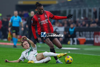 2023-12-30 - Rafael Leao of AC Milan competes for the ball with Marcus Pedersen of US Sassuolo during Serie A 2023/24 football match between AC Milan and US Sassuolo at San Siro Stadium, Milan, Italy on December 30, 2023 - AC MILAN VS US SASSUOLO - ITALIAN SERIE A - SOCCER