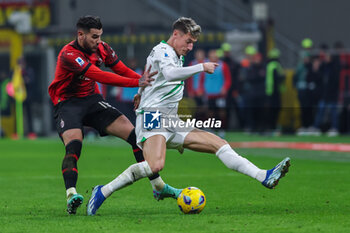 2023-12-30 - Andrea Pinamonti of US Sassuolo competes for the ball with Theo Hernandez of AC Milan during Serie A 2023/24 football match between AC Milan and US Sassuolo at San Siro Stadium, Milan, Italy on December 30, 2023 - AC MILAN VS US SASSUOLO - ITALIAN SERIE A - SOCCER