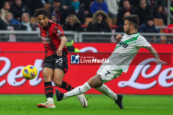 2023-12-30 - Kevin Zeroli of AC Milan seen in action with Matheus Henrique of US Sassuolo during Serie A 2023/24 football match between AC Milan and US Sassuolo at San Siro Stadium, Milan, Italy on December 30, 2023 - AC MILAN VS US SASSUOLO - ITALIAN SERIE A - SOCCER