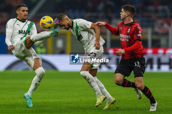 2023-12-30 - Jeremy Toljan of US Sassuolo dcompetes for the ball with Ruan Tressoldi of US Sassuolo and Christian Pulisic of AC Milan uring Serie A 2023/24 football match between AC Milan and US Sassuolo at San Siro Stadium, Milan, Italy on December 30, 2023 - AC MILAN VS US SASSUOLO - ITALIAN SERIE A - SOCCER