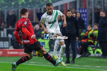 2023-12-30 - Jeremy Toljan of US Sassuolo competes for the ball with Luka Jovic of AC Milan during Serie A 2023/24 football match between AC Milan and US Sassuolo at San Siro Stadium, Milan, Italy on December 30, 2023 - AC MILAN VS US SASSUOLO - ITALIAN SERIE A - SOCCER
