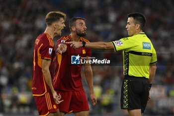 2023-09-01 - Referee Antonio Rapuano and Bryan Cristante of A.S. Roma during the 3rd day of the Serie A Championship between A.S. Roma - A.C. Milan on September 1, 2023 at the Olympic Stadium in Rome, Italy. - AS ROMA VS AC MILAN - ITALIAN SERIE A - SOCCER