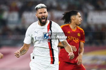 2023-09-01 - Olivier Giroud of Milan celebrates after scoring 0-1 goal by penalty during the Italian championship Serie A football match between AS Roma and AC Milan on September 1, 2023 at Stadio Olimpico in Rome, Italy - FOOTBALL - ITALIAN CHAMP - AS ROMA V AC MILAN - ITALIAN SERIE A - SOCCER