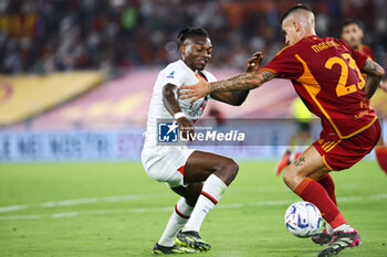2023-09-01 - Rafael Leao of Milan (L) vies of the ball with Gianluca Mancini of Roma (R) during the Italian championship Serie A football match between AS Roma and AC Milan on September 1, 2023 at Stadio Olimpico in Rome, Italy - FOOTBALL - ITALIAN CHAMP - AS ROMA V AC MILAN - ITALIAN SERIE A - SOCCER