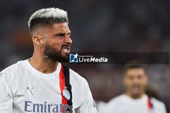 2023-09-01 - Olivier Giroud of Milan celebrates after scoring 0-2 goal during the Italian championship Serie A football match between AS Roma and AC Milan on September 1, 2023 at Stadio Olimpico in Rome, Italy - FOOTBALL - ITALIAN CHAMP - AS ROMA V AC MILAN - ITALIAN SERIE A - SOCCER