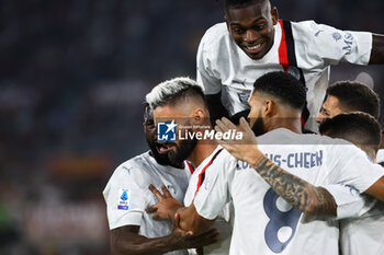 2023-09-01 - Olivier Giroud of Milan (L) celebrates with his teammates after scoring 0-2 goal during the Italian championship Serie A football match between AS Roma and AC Milan on September 1, 2023 at Stadio Olimpico in Rome, Italy - FOOTBALL - ITALIAN CHAMP - AS ROMA V AC MILAN - ITALIAN SERIE A - SOCCER