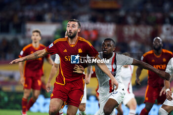 2023-09-01 - Bryan Cristante of Roma (L) and Pierre Kalulu of Milan (R) in action during the Italian championship Serie A football match between AS Roma and AC Milan on September 1, 2023 at Stadio Olimpico in Rome, Italy - FOOTBALL - ITALIAN CHAMP - AS ROMA V AC MILAN - ITALIAN SERIE A - SOCCER