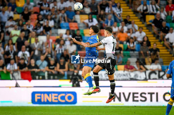 2023-09-02 - Header of Frosinone's Abdou Harroui hindered by Udinese's Nehuen Perez - UDINESE CALCIO VS FROSINONE CALCIO - ITALIAN SERIE A - SOCCER