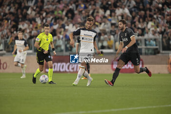 2023-09-26 - Remi Oudin of Us Lecce and Manuel Locatelli of Juventus during the Italian Serie A, football match between Juventus Fc and Us Lecce on 26 September 2023 at Allianz stadium, Turin, Italy. Photo Nderim Kaceli - JUVENTUS FC VS US LECCE - ITALIAN SERIE A - SOCCER