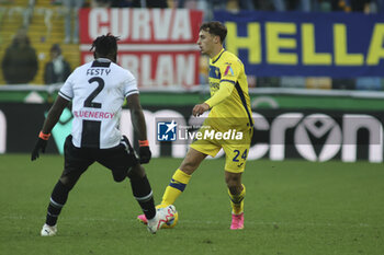 2023-12-03 - Filippo Terracciano of Hellas Verona FC battle for the ball with Festy Ebosele of Udinese FC  during Udinese Calcio vs Hellas Verona FC, 14° Serie A Tim 2023-24 game at Bluenergy Stadium - Stadio Friuli in Udine (UD), Italy, on Dicember 03, 2023. - UDINESE CALCIO VS HELLAS VERONA FC - ITALIAN SERIE A - SOCCER