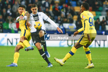 2023-12-03 - Lorenzo Lucca of Udinese FC  battle for the ball with Bruno Amione of Hellas Verona FC and Michael Folorunsho of Hellas Verona FC during Udinese Calcio vs Hellas Verona FC, 14° Serie A Tim 2023-24 game at Bluenergy Stadium - Stadio Friuli in Udine (UD), Italy, on Dicember 03, 2023. - UDINESE CALCIO VS HELLAS VERONA FC - ITALIAN SERIE A - SOCCER