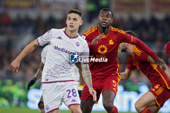 2023-12-10 - Evan Ndicka of Roma and Lucas Martinez Quarta of Fiorentina in action during the Italian championship Serie A football match between AS Roma and ACF Fiorentina on December 10, 2023 at Stadio Olimpico in Rome, Italy - FOOTBALL - ITALIAN CHAMP - ROMA V FIORENTINA - ITALIAN SERIE A - SOCCER