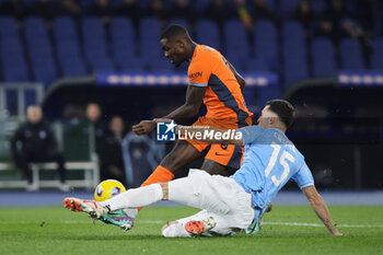 2023-12-17 - Marcus Thuram of Internazionale kicks the ball under pressure from Nicolo' Casale of Lazio during the Italian championship Serie A football match between SS Lazio and FC Internazionale on December 17, 2023 at Stadio Olimpico in Rome, Italy - FOOTBALL - ITALIAN CHAMP - LAZIO V INTERNAZIONALE - ITALIAN SERIE A - SOCCER