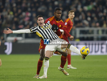 2023-12-30 - Dusan Vlahovic of Juventus and Evan Ndicka of As Roma during the Italian Serie A, football match between Juventus Fc and As Roma on 30 December 2023 at Allianz Stadium, Turin, Italy. Photo Nderim Kaceli - JUVENTUS FC VS AS ROMA - ITALIAN SERIE A - SOCCER
