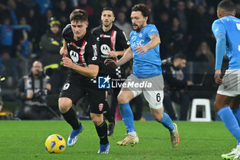 2023-12-29 - Lorenzo Colombo of AC Monza competes for the ball with Mario Rui of SSC Napoli during Serie A between SSC Napoli vs AC Monza at Diego Armando Maradona Stadium - SSC NAPOLI VS AC MONZA - ITALIAN SERIE A - SOCCER