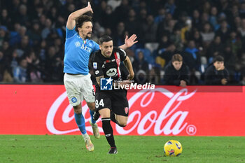 2023-12-29 - Mario Rui of SSC Napoli competes for the ball with Patrick Ciurria of AC Monza during the Serie A match between SSC Napoli vs AC Monza at Diego Armando Maradona Stadium - SSC NAPOLI VS AC MONZA - ITALIAN SERIE A - SOCCER