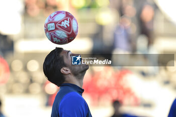 2023-11-25 - Ernesto Torregrossa (Pisa) during warm up with the red ball, used on the occasion of the International Day for the Elimination of Violence against Women - PISA SC VS BRESCIA CALCIO - ITALIAN SERIE B - SOCCER