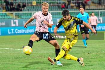 2023-12-16 - Simon Graves Jensen (Palermo F.C.) in action against Miguel Veloso (Pisa S.C. 1909) during the Italian Serie BKT match between Palermo F.C. vs. Pisa U.S. 1909 at the Renzo Barbera Stadium in Palermo, Italy - PALERMO FC VS AC PISA - ITALIAN SERIE B - SOCCER