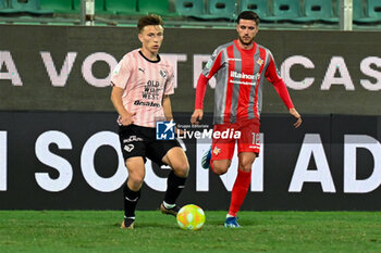 2023-12-26 - Kristoffer Lund (Palermo F.C.) in action against Paolo Ghiglione (U.S. Cremonese) during the Italian Serie BKT match between Palermo F.C. vs. U.S. Cremonese at the Renzo Barbera Stadium in Palermo, Italy - PALERMO FC VS US CREMONESE - ITALIAN SERIE B - SOCCER