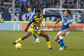 2023-12-26 - Woyo Coulibaly of Parma Calcio  competes for the ball with Davide Adorni of Brescia FC during Brescia FC vs Parma Calcio, 19° Serie BKT 2023-24 game at Mario Rigamonti stadium in Brescia, Italy, on Dicember 26, 2023. - BRESCIA CALCIO VS PARMA CALCIO - ITALIAN SERIE B - SOCCER