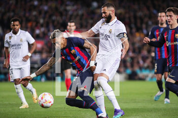 2023-04-05 - Raphinha of FC Barcelona and Karim Benzema of Real Madrid during the Spanish Cup, Copa del Rey, Semi Finals 2nd leg football match between FC Barcelona and Real Madrid on April 5, 2023 at Spotify Camp Nou stadium in Barcelona, Spain - FOOTBALL - SPANISH CUP - FC BARCELONA V REAL MADRID - SPANISH CUP - SOCCER