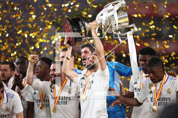 2023-05-06 - Nacho Fernandez of Real Madrid celebrates with the Champions trophy after the Spanish Cup, Copa del Rey, Final football match between Real Madrid CF and CA Osasuna on May 6, 2023 at Estadio de La Cartuja in Sevilla, Spain - FOOTBALL - SPANISH CUP - FINAL - REAL MADRID V OSASUNA - SPANISH CUP - SOCCER