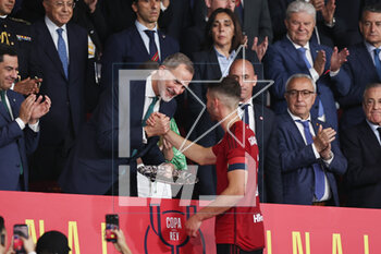 2023-05-06 - David Garcia of Osasuna receives the second place trophy from Felipe VI and Infanta Sofia after the Spanish Cup, Copa del Rey, Final football match between Real Madrid CF and CA Osasuna on May 6, 2023 at Estadio de La Cartuja in Sevilla, Spain - FOOTBALL - SPANISH CUP - FINAL - REAL MADRID V OSASUNA - SPANISH CUP - SOCCER
