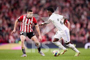 2023-01-22 - Vinicius Junior of Real Madrid CF and Oscar de Marcos of Athletic Club during the Spanish championship La Liga football match between Athletic Club and Real Madrid CF on January 22, 2023 at San Mames stadium in Bilbao, Spain - FOOTBALL - SPANISH CHAMP - ATHLETIC CLUB V REAL MADRID - SPANISH LA LIGA - SOCCER