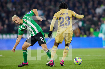 2023-02-01 - Sergio Canales of Real Betis and Jules Kounde of FC Barcelona during the Spanish championship La Liga football match between Real Betis and FC Barcelona on February 1, 2023 at Benito Villamarin stadium in Sevilla, Spain - FOOTBALL - SPANISH CHAMP - REAL BETIS V FC BARCELONA - SPANISH LA LIGA - SOCCER