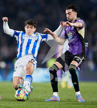 2023-02-05 - Pablo Marin of Real Sociedad competes for the ball with Kike Perez of Real Valladolid CF during the Spanish championship La Liga football match between Real Sociedad and Real Valladolid CF on February 5, 2023 at Reale Arena in San Sebastian, Spain - FOOTBALL - SPANISH CHAMP - REAL SOCIEDAD V REAL VALLADOLID - SPANISH LA LIGA - SOCCER