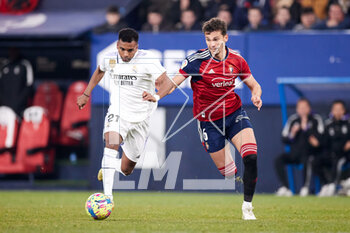 2023-02-18 - Rodrygo Goes of Real Madrid CF competes for the ball with Lucas Torro of CA Osasuna during the Spanish championship La Liga football match between CA Osasuna and Real Madrid CF on February 18, 2023 at El Sadar in Pamplona, Spain - FOOTBALL - SPANISH CHAMP - OSASUNA V REAL MADRID - SPANISH LA LIGA - SOCCER