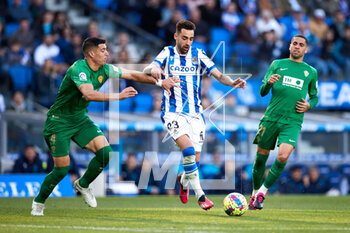 2023-03-19 - Brais Mendez of Real Sociedad competes for the ball with Omar Mascarell of Elche during the Spanish championship La Liga football match between Real Sociedad and Elche CF on March 19, 2023 at Reale Area in San Sebastian, Spain - FOOTBALL - SPANISH CHAMP - REAL SOCIEDAD V ELCHE - SPANISH LA LIGA - SOCCER