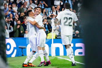 2023-04-22 - Éder Militão (Real Madrid) and Marco Asensio (Real Madrid) celebrate a goal during the football match between
Real Madrid and Celta Vigo
valid for the match day 30 of the Spanish first division league “La Liga” celebrated in Madrid, Spain at Bernabeu stadium on Saturday 22 April 2023 - REAL MADRID VS CELTA VIGO - SPANISH LA LIGA - SOCCER